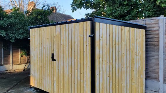 8 Space timber clad cycle shelter side and front.jpg