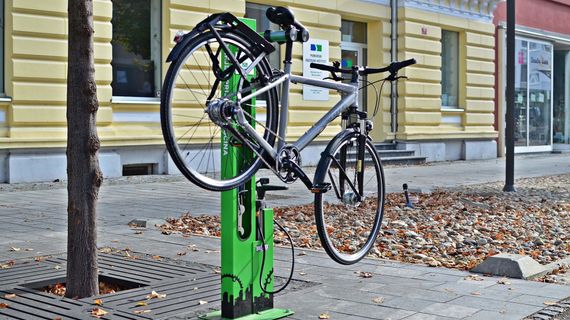Public bike repair stand with pump