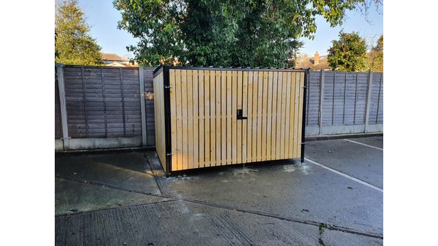 8 Space timber clad cycle shelter front gate closed.jpg