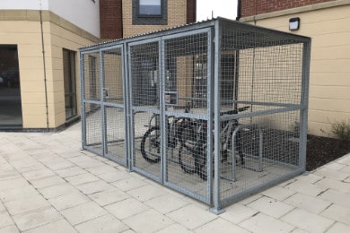 Secure Bike Shelter with bikes inside locked to Traditional Sheffield Cycle Stands
